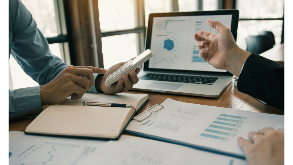 2 people financial planning in an office