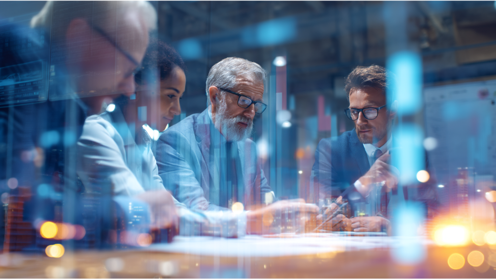 Team of business professionals in a modern office discussing supply chain analytics with a digital chart overlay.